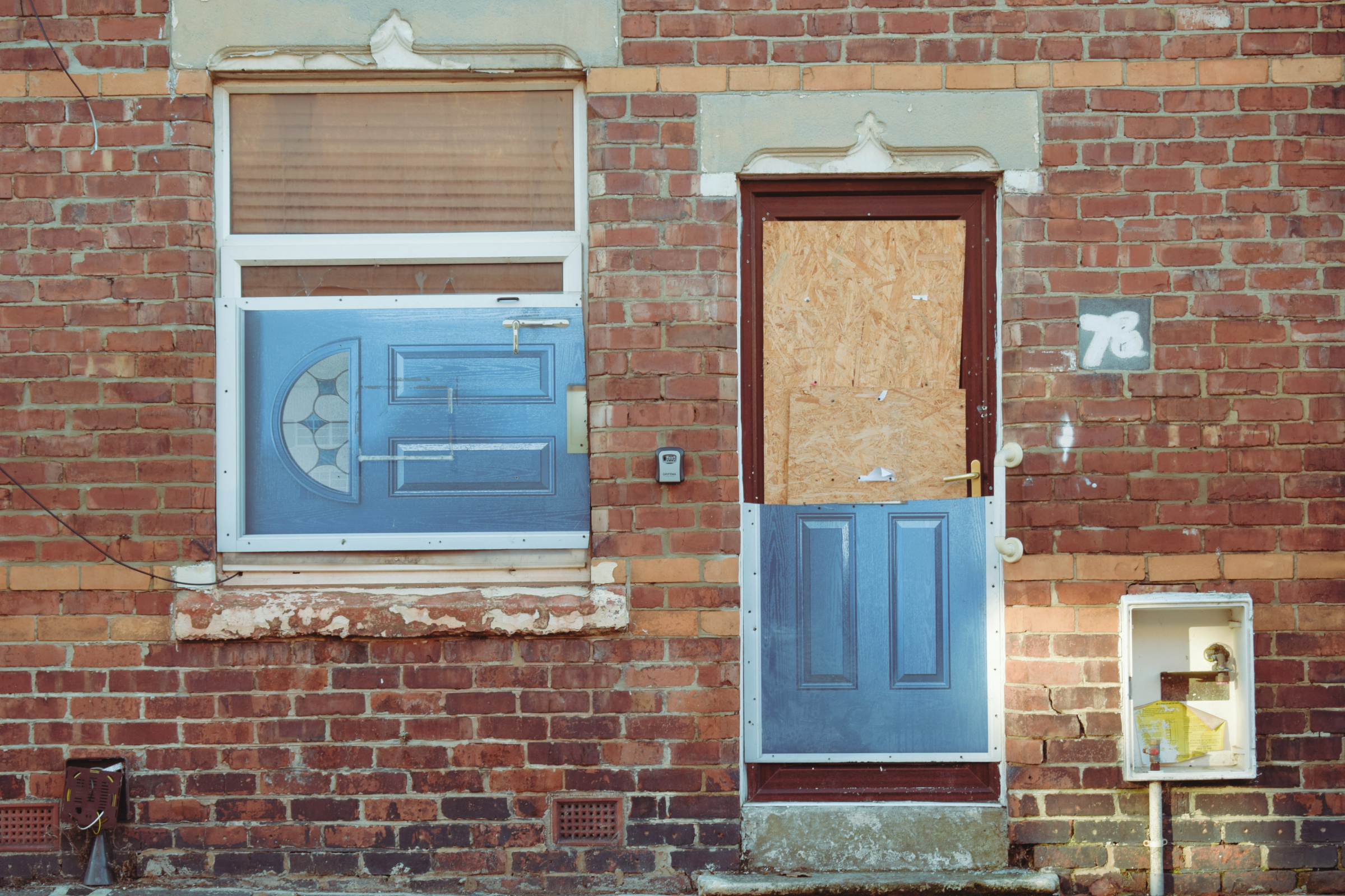 A window in Horden is covered up with an image of a door
