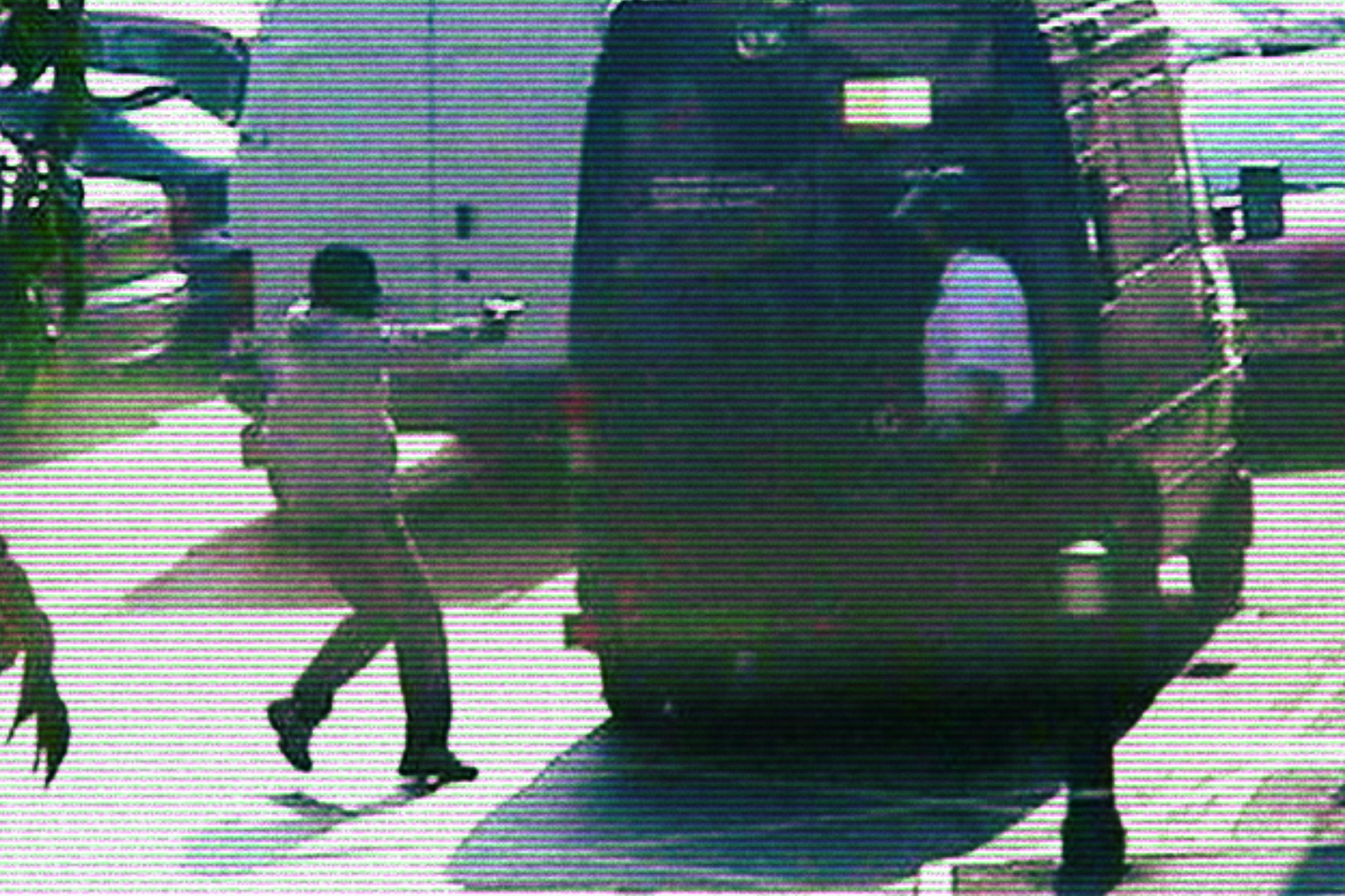 Mark Nunes points a gun at the security guard during the Chandler's Ford raid (Handout)